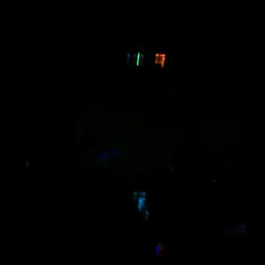 Lyft Driver at Midnight Playing Two Radio Stations at Once (Recorded with My Phone)