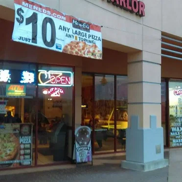 Hilltop Plaza and a Gas Station at Dusk