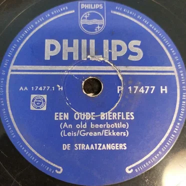 Een oude bierfles / De schooier en zijn hond