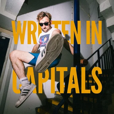 WRITTEN IN CAPITALS