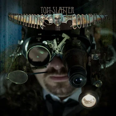Spinning The Compass (2016 remaster) by Tom Slatter - album cover