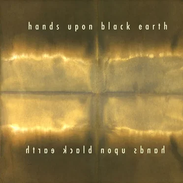 Hands Upon Black Earth