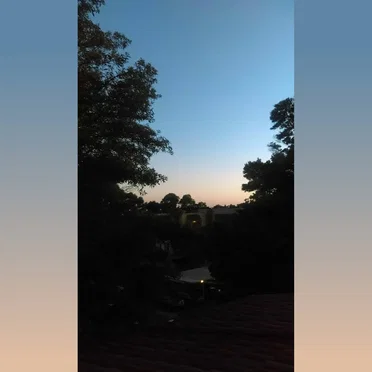 Standing at the Top of the Stairs at Dusk