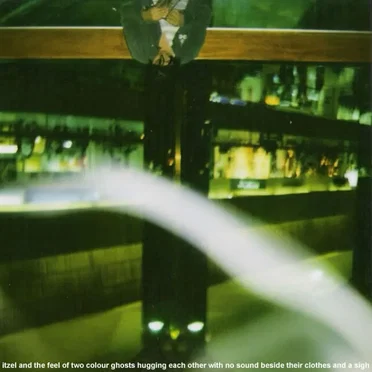 Itzel and the Sound of Two Colour Ghosts Hugging Each Other With No Sound Beside Their Clothes and a Sigh