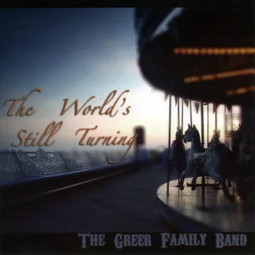 The World's Still Turning by The Greer Family Band - album cover
